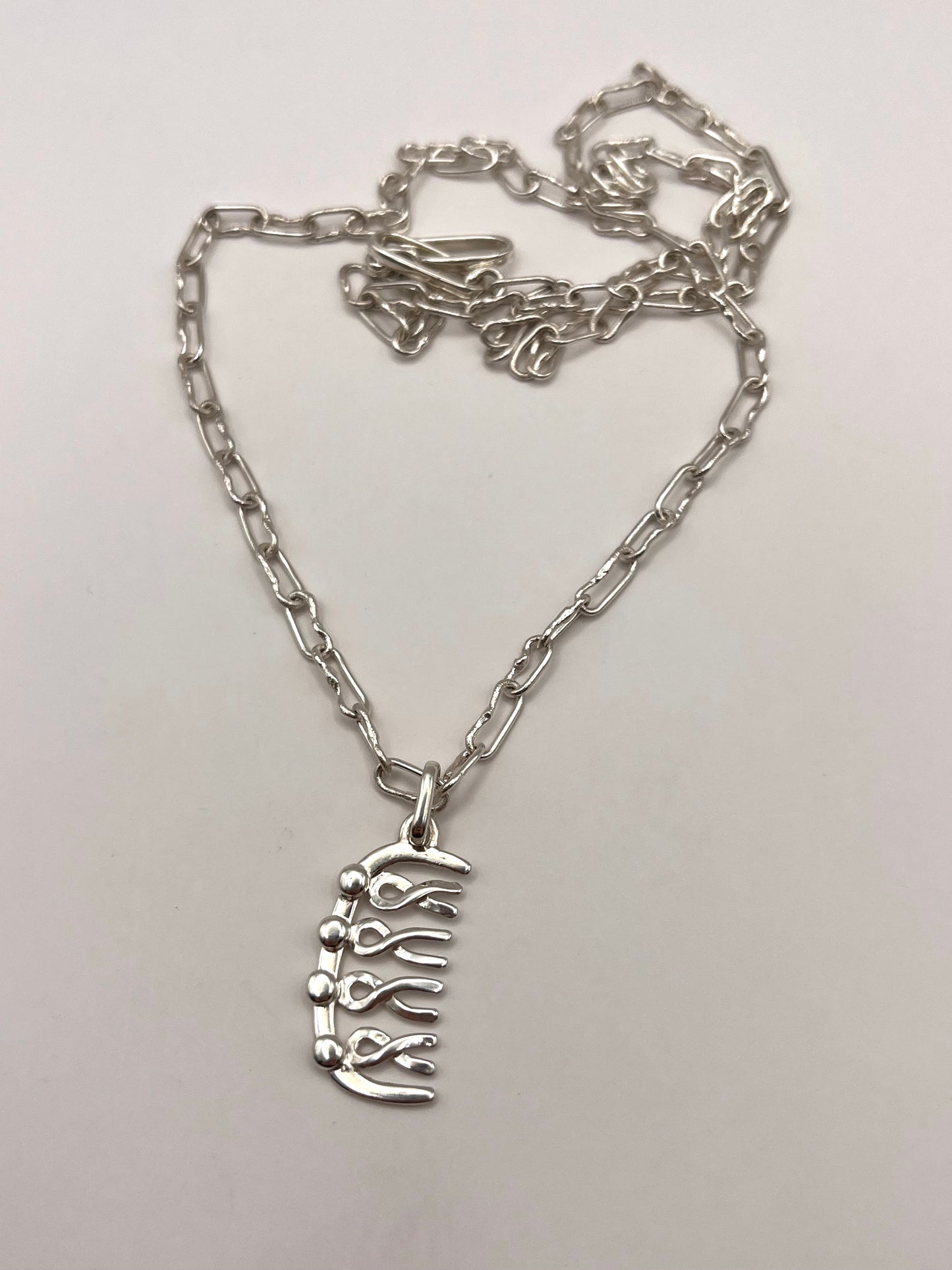 arm in arm comb pendant and chain