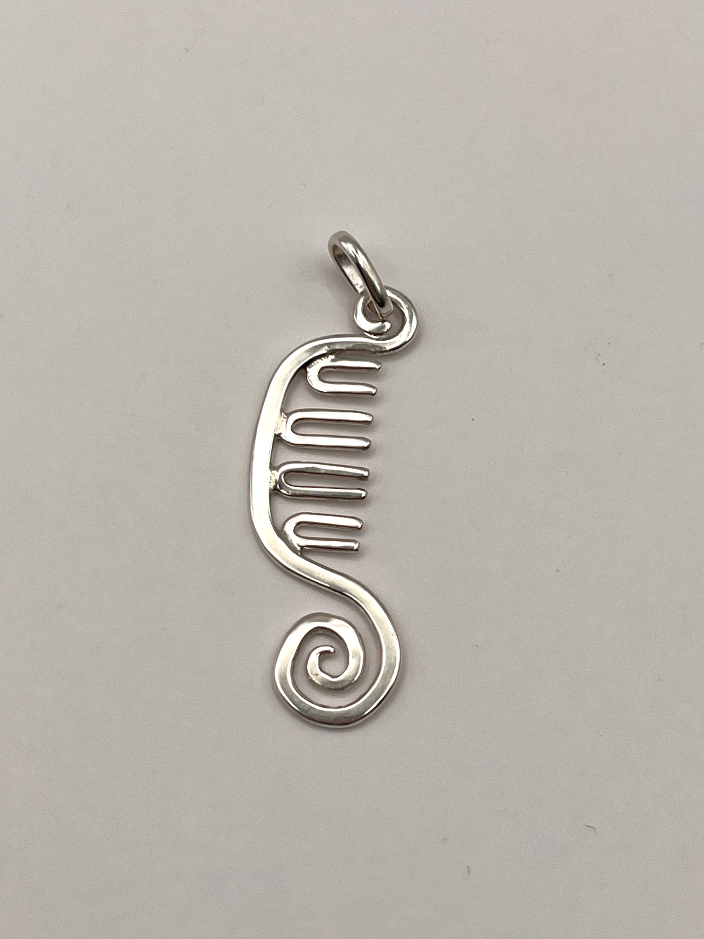 spiral comb pendant